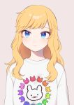  1girl animal_print bangs beige_background blue_eyes blush bunny_print cho628 commentary_request eyebrows_visible_through_hair highres idolmaster idolmaster_cinderella_girls looking_at_viewer ootsuki_yui simple_background smile solo sweater upper_body wavy_hair white_sweater 