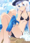  1girl beach bikini black_bikini black_headwear blue_eyes blue_sky breasts cloud commentary_request day flat_cap hammer_and_sickle hat hibiki_(kantai_collection) highres horizon kantai_collection long_hair looking_at_viewer ocean outdoors perspective silver_hair sitting sky small_breasts solo swimsuit tetuw water_gun waves 