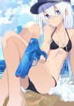  1girl beach bikini black_bikini black_headwear blue_eyes blue_sky breasts cloud commentary_request day flat_cap hammer_and_sickle hat hibiki_(kantai_collection) highres horizon kantai_collection long_hair looking_at_viewer ocean outdoors perspective silver_hair sitting sky small_breasts solo swimsuit tetuw water_gun waves 