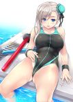 1girl asymmetrical_hair bangs bare_shoulders black_swimsuit blue_eyes blush breasts bun_cover cleavage collarbone competition_swimsuit fate/grand_order fate_(series) grey_hair hair_bun large_breasts long_hair looking_at_viewer lying miyamoto_musashi_(fate/grand_order) miyamoto_musashi_(swimsuit_berserker)_(fate) mizuhara_yuu on_back one-piece_swimsuit poolside ribbon smile soaking_feet solo swept_bangs swimsuit swimsuit_tug thighs wet wristband 