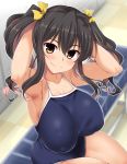  1girl adjusting_hair alternate_hairstyle armpits arms_up black_hair blue_swimsuit blurry blurry_background blush breasts collarbone commentary_request covered_nipples eyebrows_visible_through_hair fang fang_out hair_between_eyes hair_ribbon highres indoors kantai_collection large_breasts legs_together looking_at_viewer multicolored_hair naganami_(kantai_collection) pink_hair ribbon school_swimsuit sitting smile solo swimsuit twintails two-tone_hair wavy_hair yellow_eyes yellow_ribbon yoshi_tama 