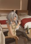  1girl alternate_costume bed bedroom beer_can beige_dress black_legwear bottle can chair commentary_request grey_eyes highres indoors kachi_(kachi5100) kantai_collection kashima_(kantai_collection) looking_at_viewer pantyhose profile sidelocks silver_hair sitting sleeveless solo strong_zero table tsurime twintails twitter_username wavy_hair 