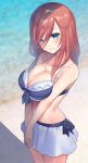  1girl bangs bare_arms bare_shoulders bikini bikini_skirt blue_eyes blurry blurry_background blush breasts brown_hair cleavage closed_mouth collarbone commentary_request cowboy_shot go-toubun_no_hanayome hair_between_eyes halter_top halterneck highres kakaon large_breasts long_hair looking_at_viewer nakano_miku smile solo standing swimsuit v_arms water white_bikini 