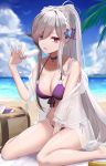  1girl azur_lane bangs beach bikini blush breasts choker cleavage collarbone day dunkerque_(azur_lane) dunkerque_(summer_sucre)_(azur_lane) eternity_(pixiv8012826) eyebrows_visible_through_hair flower food grey_hair hair_ornament hairband highres holding holding_food large_breasts long_hair looking_at_viewer navel outdoors pink_eyes ponytail purple_bikini sidelocks sitting solo swimsuit thighs wariza 