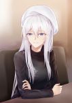  1girl azur_lane black_sweater breasts commentary enterprise_(azur_lane) eyebrows_visible_through_hair hat highres large_breasts long_hair looking_at_viewer purple_eyes silver_hair sitting solo suprii sweater 
