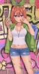  1girl bare_arms blue_eyes blue_shorts breasts brick_wall brown_hair cleavage collarbone cowboy_shot crop_top denim denim_shorts go-toubun_no_hanayome graffiti green_jacket green_ribbon grin groin hair_between_eyes hair_ribbon hands_up highres holding hood hooded_jacket izumo_neru jacket jacket_on_shoulders jewelry looking_at_viewer medium_breasts midriff mouth_pull nakano_yotsuba navel necklace paint_splatter ribbon shirt short_hair short_shorts shorts smile solo spray_can standing sweat thighs v-shaped_eyebrows white_shirt 