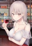 1girl alcohol bangs bare_shoulders blurry blurry_background bottle breasts brown_eyes brown_hair cleavage cleavage_cutout closed_mouth commentary_request cup depth_of_field drinking_glass eyebrows_visible_through_hair hair_between_eyes highres holding holding_cup large_breasts long_hair looking_at_viewer off-shoulder_shirt off_shoulder original piripun shirt short_sleeves smile solo upper_body white_shirt wine wine_glass 