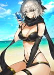  1girl ahoge bare_shoulders beach between_legs bikini black_bikini black_gloves black_legwear black_scarf blonde_hair bow breasts can cleavage closed_mouth cloud cloudy_sky commentary_request dutch_angle ero_waifu eyebrows_visible_through_hair fate/grand_order fate_(series) gloves hair_bow hand_between_legs holding holding_can looking_at_viewer medium_breasts multi-strapped_bikini navel ocean okita_souji_(fate)_(all) okita_souji_(swimsuit_assassin)_(fate) scarf seiza short_hair sitting sky smile solo swimsuit thigh_strap thighs 