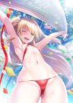  1girl admiral_hipper_(azur_lane) ahoge armpits arms_up azur_lane bangs bikini blonde_hair blue_sky blush body_writing breasts confetti cowboy_shot criss-cross_halter day eyebrows_visible_through_hair flat_chest floating_hair green_eyes hair_between_eyes halterneck highres holding holding_towel ken_ill long_hair looking_at_viewer micro_bikini mole mole_under_eye navel one_eye_closed open_mouth outdoors red_bikini skindentation sky smile stomach swimsuit towel two_side_up wind 