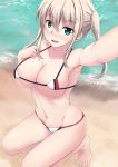  1girl barefoot beach bikini blonde_hair blush breasts cleavage collarbone commentary_request fuuma_nagi graf_zeppelin_(kantai_collection) grey_eyes kantai_collection large_breasts looking_at_viewer micro_bikini navel reaching_out self_shot sidelocks solo squatting swimsuit tsurime twintails two-tone_bikini water waves white_bikini 