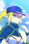  1girl ahoge artoria_pendragon_(all) baseball_cap blonde_hair blue_eyes blue_headwear breasts cleavage closed_mouth eyebrows_visible_through_hair fate/grand_order fate_(series) floating_hair hair_between_eyes hat highres karakuri2357 long_hair long_sleeves looking_at_viewer medium_breasts mysterious_heroine_xx_(foreigner) ponytail shiny shiny_hair shrug_(clothing) smile solo upper_body white_bikini_top wristband 