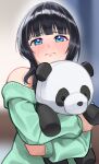  1girl asaka_karin black_hair blue_eyes blunt_bangs blurry blurry_background blush closed_mouth commentary_request furrowed_brow green_sweater highres holding holding_stuffed_toy hugging_doll hugging_object indoors long_sleeves looking_at_viewer love_live! love_live!_nijigasaki_high_school_idol_club medium_hair off_shoulder solo stuffed_animal stuffed_panda stuffed_toy sweater tanaka_yaku upper_body 
