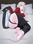  1girl abaresouka absurdres ass barefoot black_gloves breasts clothing_cutout feet gloves goddess_of_victory:_nikke grey_hair hair_ornament hairclip highres jacket large_breasts light_blush messy_hair on_bed red_jacket sharp_teeth teeth yellow_eyes yulha_(nikke) 