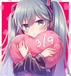  1girl 39 amane_kurumi aqua_eyes aqua_hair black_sleeves blush commentary crossed_arms cushion detached_sleeves hair_ornament hatsune_miku headphones heart heart_background holding_heart long_hair looking_at_viewer parted_lips red_background twintails upper_body very_long_hair vocaloid 
