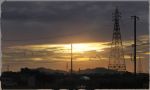  blurry border cloud commentary dark depth_of_field ground_vehicle hill motor_vehicle no_humans original outdoors power_lines rural scenery signature sky sunlight sunset telephone_pole town twilight van yk_funa 