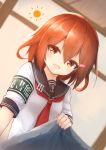  anchor_symbol armband blanket brown_eyes brown_hair centi_mnkt fang hair_ornament hairclip highres ikazuchi_(kantai_collection) kantai_collection neckerchief red_neckwear safety_pin school_uniform serafuku short_hair 