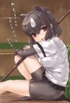  1girl animal_ears arm_rest bangs bear_ears bear_girl bear_paw_hammer bear_tail bike_shorts black_hair black_skirt brown_bear_(kemono_friends) brown_eyes crossed_arms elbow_gloves extra_ears eyebrows_visible_through_hair fingerless_gloves from_side gloves hair_between_eyes highres kemono_friends knee_up looking_at_viewer microskirt multicolored_hair open_mouth outstretched_leg over_shoulder shirt shoes short_hair short_sleeves shorts shorts_under_skirt sidelocks sitting skirt smile solo tadano_magu tail translation_request two-tone_hair weapon weapon_over_shoulder white_hair 