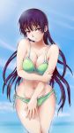  1girl arm_grab bikini blue_eyes breasts cleavage green_bikini groin highres kanoe_yuuko large_breasts long_hair looking_at_viewer navel purple_hair red_eyes side-tie_bikini solace solo swimsuit tasogare_otome_x_amnesia water 