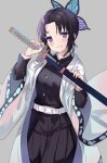  1girl bangs belt belt_buckle black_hair black_jacket black_pants blush breasts buckle butterfly_hair_ornament closed_mouth commentary english_commentary eyebrows_visible_through_hair forehead gradient_hair grey_background hair_ornament hands_up highres hitsukuya holding holding_sheath holding_sword holding_weapon jacket katana kimetsu_no_yaiba kochou_shinobu long_sleeves looking_at_viewer multicolored_hair open_clothes pants parted_bangs purple_eyes purple_hair sheath small_breasts smile solo sword unsheathing weapon white_belt wide_sleeves 