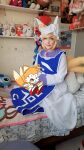  1girl absurdres bed blonde_hair chili_dog cosplay cosplay_photo fox fox_tail highres kitsune kyuubi lilo_&amp;_stitch multiple_tails ninetales non-web_source on_bed photo_(medium) sonic_(series) stitch_(lilo_&amp;_stitch) stuffed_animal stuffed_toy tail tails_(sonic) touhou yakumo_ran yakumo_ran_(fox) 