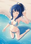  1girl ahoge arm_up armpits barefoot beach bikini blue_bikini blue_eyes blue_hair breasts cleavage commentary feet grin highres kneeling make_heroine_ga_oo_sugiru! medium_breasts navel ocean one_eye_closed ponytail sand scrunchie sidelocks simple_background smile solo swimsuit symbol-only_commentary teeth toramaru_orange v yanami_anna 