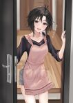  1girl absurdres aburi-gatana antenna_hair apron black_eyes black_hair black_shirt blush collarbone cowboy_shot door from_outside hand_up heart highres idolmaster idolmaster_(classic) indoors kikuchi_makoto long_sleeves looking_at_viewer open_mouth pink_apron shirt short_hair shorts smile solo standing teeth translated upper_teeth_only 