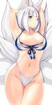  1girl ;) animal_ear_fluff animal_ears areolae arms_behind_head azur_lane bangs bikini blue_eyes blunt_bangs breasts closed_mouth collarbone eyebrows_visible_through_hair fox_ears fox_tail kaga_(azur_lane) medium_breasts multiple_tails navel one_eye_closed short_hair sia_namsbinpeni simple_background smile solo swimsuit tail white_background white_bikini white_hair 