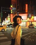  1girl bag black_eyes brown_hair building car city crosswalk curly_hair display forced_perspective highres looking_at_viewer looking_back low_ponytail motor_vehicle no_entry_sign original pedestrian_lights ponytail road road_sign sam_yang shoulder_bag sign smile solo street sweater tote_bag upper_body yellow_sweater 