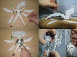  blood death dismemberment doll fairy guro injury keychain nude on_(papercraft_artist) paper_child papercraft paperwork severed_head severed_limb torture wings 
