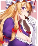 1girl blonde_hair blush bow breasts candy chocolate choker cleavage commentary_request dress eating elbow_gloves food gloves hair_bow hat hat_ribbon heart heart-shaped_chocolate heart-shaped_food highres kisaragi_koushi large_breasts long_hair looking_at_viewer mob_cap puffy_short_sleeves puffy_sleeves purple_dress purple_eyes red_bow ribbon ribbon_choker short_sleeves smile solo touhou valentine white_gloves white_hat yakumo_yukari 