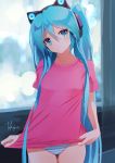  1girl artist_name blue_eyes blue_hair cat_ear_headphones cowboy_shot hair_between_eyes hatsune_miku head_tilt headphones highres long_hair looking_at_viewer no_pants panties pink_shirt shirt solo standing striped striped_panties t-shirt takepon1123 twintails underwear very_long_hair vocaloid 