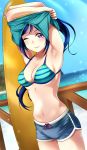  1girl beach bikini blue_hair blue_shorts blue_sky cowboy_shot day dutch_angle highres horizon light_rays long_hair looking_at_viewer love_live! love_live!_sunshine!! matsuura_kanan mountain ocean outdoors ponytail purple_eyes short_shorts shorts sky smile solo solo07450075 standing striped striped_bikini striped_bikini_top sunbeam sunlight surfboard swimsuit undressing 