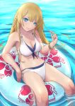  1girl alternate_costume azur_lane bikini blonde_hair blue_eyes breasts cherry_blossom_print cherry_blossoms cleavage collarbone eyebrows_visible_through_hair floating francoise0516 from_above hair_between_eyes highres innertube kongou_(azur_lane) lifebuoy lips long_hair looking_at_viewer looking_up medium_breasts navel no_hat no_headwear outdoors playing_with_own_hair ripples side-tie_bikini sitting smile solo swimsuit water white_bikini white_swimsuit 