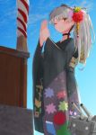  1girl ;) alternate_costume amatsukaze_(kantai_collection) black_kimono blue_sky brown_eyes floral_print from_below furisode hands_together hatsumoude highres japanese_clothes kamome_donburi kantai_collection kimono long_hair looking_at_viewer one_eye_closed rensouhou-kun silver_hair sky smile two_side_up 