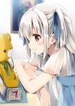  1girl bangs blue_dress blue_ribbon blush closed_mouth commentary_request crossed_arms dress eyebrows_visible_through_hair grey_hair hair_between_eyes hair_ribbon long_hair looking_away natsume_eri original profile red_eyes ribbon see-through see-through_sleeves short_sleeves smile solo stuffed_animal stuffed_toy teddy_bear two_side_up wide_sleeves 