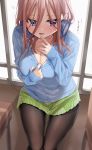  1girl black_legwear blue_cardigan blue_eyes blush breasts cardigan chigusa_minori cleavage go-toubun_no_hanayome green_skirt hair_over_eyes headphones highres large_breasts long_sleeves nakano_miku open_mouth pantyhose pleated_skirt red_hair skirt solo translation_request 