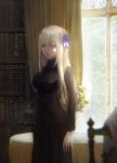  1girl arm_at_side black_dress black_theme blue_eyes blurry_foreground book bookshelf breasts calbee day dress flower hair_flower hair_ornament highres indoors large_breasts long_hair looking_at_viewer original platinum_blonde_hair solo standing table window 