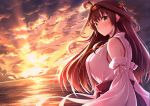  1girl ahoge blush breasts brown_hair closed_mouth cloud detached_sleeves double_bun eyebrows_visible_through_hair grey_eyes hair_between_eyes hair_ornament hairband japanese_clothes kantai_collection kongou_(kantai_collection) large_breasts long_hair looking_at_viewer nicoby nontraditional_miko ocean solo sunlight sunset 
