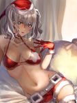  1girl amakaze blue_eyes blush breasts christmas eyebrows_visible_through_hair fur-trimmed_shorts fur_trim gloves hair_between_eyes hat highres kantai_collection kashima_(kantai_collection) large_breasts long_hair looking_at_viewer navel red_bikini_top red_gloves red_shorts santa_costume santa_hat short_shorts shorts silver_hair sitting smile solo thighhighs twintails wavy_hair 