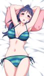  1girl :o armpits arms_behind_head arms_up ass_visible_through_thighs bangs bare_arms bed_sheet bikini blue_hair blush breasts cleavage collarbone from_above high_ponytail highres long_hair love_live! love_live!_sunshine!! lying matsuura_kanan medium_breasts navel on_back on_bed open_mouth pillow purple_eyes side-tie_bikini solo striped striped_bikini swimsuit thighs yopparai_oni 