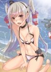  1girl absurdres alternate_costume amatsukaze_(kantai_collection) beach bikini blush breasts eyebrows_visible_through_hair hair_between_eyes hair_tubes highres kantai_collection lifebuoy long_hair looking_at_viewer medium_breasts nanamagaru ocean open_mouth rensouhou-kun silver_hair sitting solo swimsuit two_side_up water white_bikini 