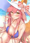  1girl animal_ears beach bikini blush bracelet breasts cleavage dutch_angle fate/grand_order fate_(series) fox_ears fox_shadow_puppet fox_tail hat jewelry large_breasts long_hair looking_at_another ocean pink_hair solo swimsuit tail tamamo_(fate)_(all) tamamo_no_mae_(swimsuit_lancer)_(fate) thigh_gap untsue very_long_hair yellow_eyes 