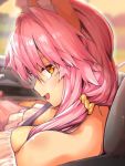  1girl animal_ear_fluff animal_ears between_breasts blush breasts cleavage commentary commentary_request eyebrows_visible_through_hair fate/extra fate/grand_order fate_(series) fox_ears fox_girl large_breasts looking_at_viewer looking_back open_mouth pink_hair solo tamamo_(fate)_(all) tamamo_no_mae_(fate) vehicle_interior wisespeak yellow_eyes 
