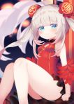  1girl :3 ahoge azur_lane bangs bare_shoulders blue_eyes blurry blurry_background blush breasts bun_cover china_dress chinese_clothes closed_mouth commentary_request depth_of_field double_bun dress eyebrows_visible_through_hair feet_out_of_frame grey_hair halsey_powell_(azur_lane) halsey_powell_(spring&#039;s_lucky_star)_(azur_lane) highres koko_ne_(user_fpm6842) looking_at_viewer red_dress sidelocks sitting sleeveless sleeveless_dress small_breasts solo twintails 