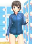  1girl absurdres aqua_swimsuit black_hair blue_eyes blue_jacket blurry breasts clothes_writing competition_swimsuit contrapposto cowboy_shot depth_of_field grin highres jacket locker locker_room looking_at_viewer one-piece_swimsuit original short_hair small_breasts smile solo standing swimsuit swimsuit_under_clothes takafumi v 