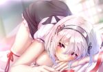  1girl azur_lane bangs blurry blurry_background blush breasts collarbone dress hair_between_eyes imo_bouya indoors lace-trimmed_hairband large_breasts looking_at_viewer on_bed puffy_sleeves red_eyes revision short_hair short_sleeves sirius_(azur_lane) solo thighhighs thighs top-down_bottom-up white_hair white_legwear 