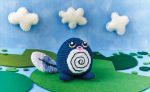  amigurumi_(medium) asako_ito black_eyes blue_sky cloud cloudy_sky commentary creature day english_commentary gen_1_pokemon lily_pad multiple_sources nature outdoors photo pokemon pokemon_(creature) pokemon_trading_card_game poliwag sky standing third-party_source unconventional_media 