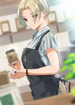  1girl apron barista black_apron black_nails blonde_hair bracelet breasts brown_eyes cafe coffee_cup collared_shirt commentary cup day disposable_cup doushimasho dutch_angle earrings employee_uniform eyebrows_visible_through_hair eyes_visible_through_hair from_side hair_over_one_eye highres holding holding_cup indoors jewelry looking_at_viewer medium_breasts mole mole_on_neck original shirt short_hair short_sleeves solo uniform upper_body 