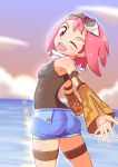  1girl ;d aero ass blush breasts cloud cougar1404 cowboy_shot detached_sleeves dusk goggles goggles_on_head looking_at_viewer looking_back medium_hair ocean one_eye_closed open_mouth pink_hair red_eyes rockman rockman_dash rockman_dash_3 scarf short_shorts shorts small_breasts smile solo sunset 