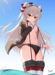 1girl amatsukaze_(kantai_collection) bikini_bottom black_bikini_bottom breasts brown_eyes cameltoe choker closed_mouth day frown grey_hair grey_shirt groin hair_between_eyes hair_tubes hairband hand_up hat highres kantai_collection long_hair long_sleeves looking_at_viewer medium_breasts mini_hat navel no_bra no_pants open_clothes open_shirt outdoors shirt solo stomach striped striped_legwear sunlight suspenders thighhighs thighs tttanggvl two_side_up wading water 